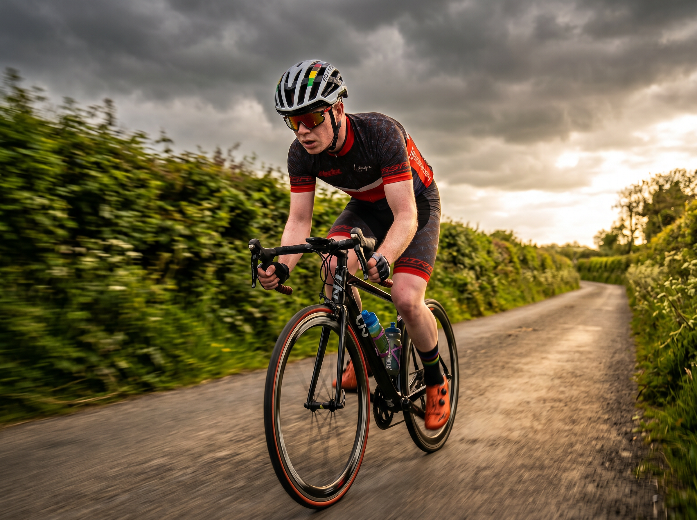 Road cyclist speeding through Irish countryside
